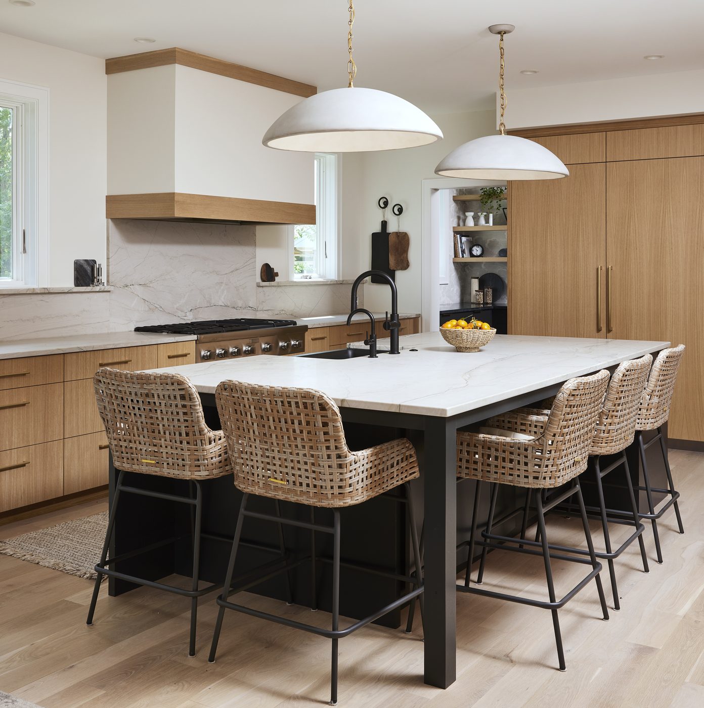 Rift oak kitchen island with woven stools